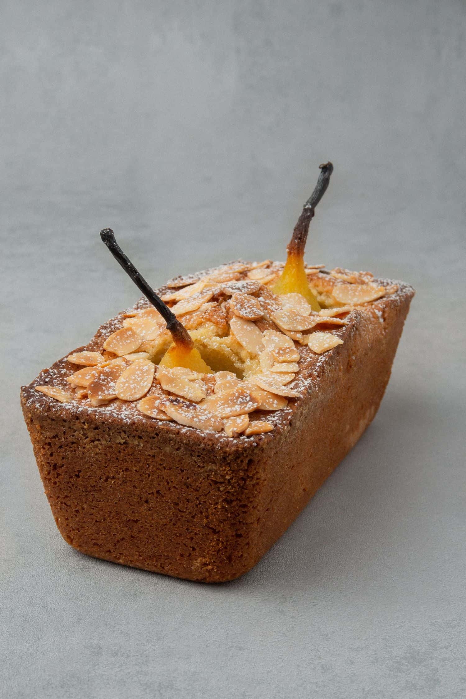 Pear loaf with almond decoration.