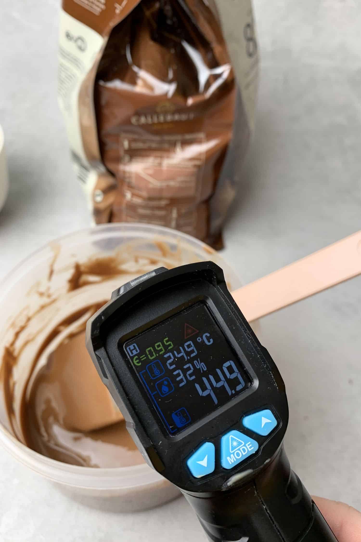 Measuring melted chocolate temperature. 