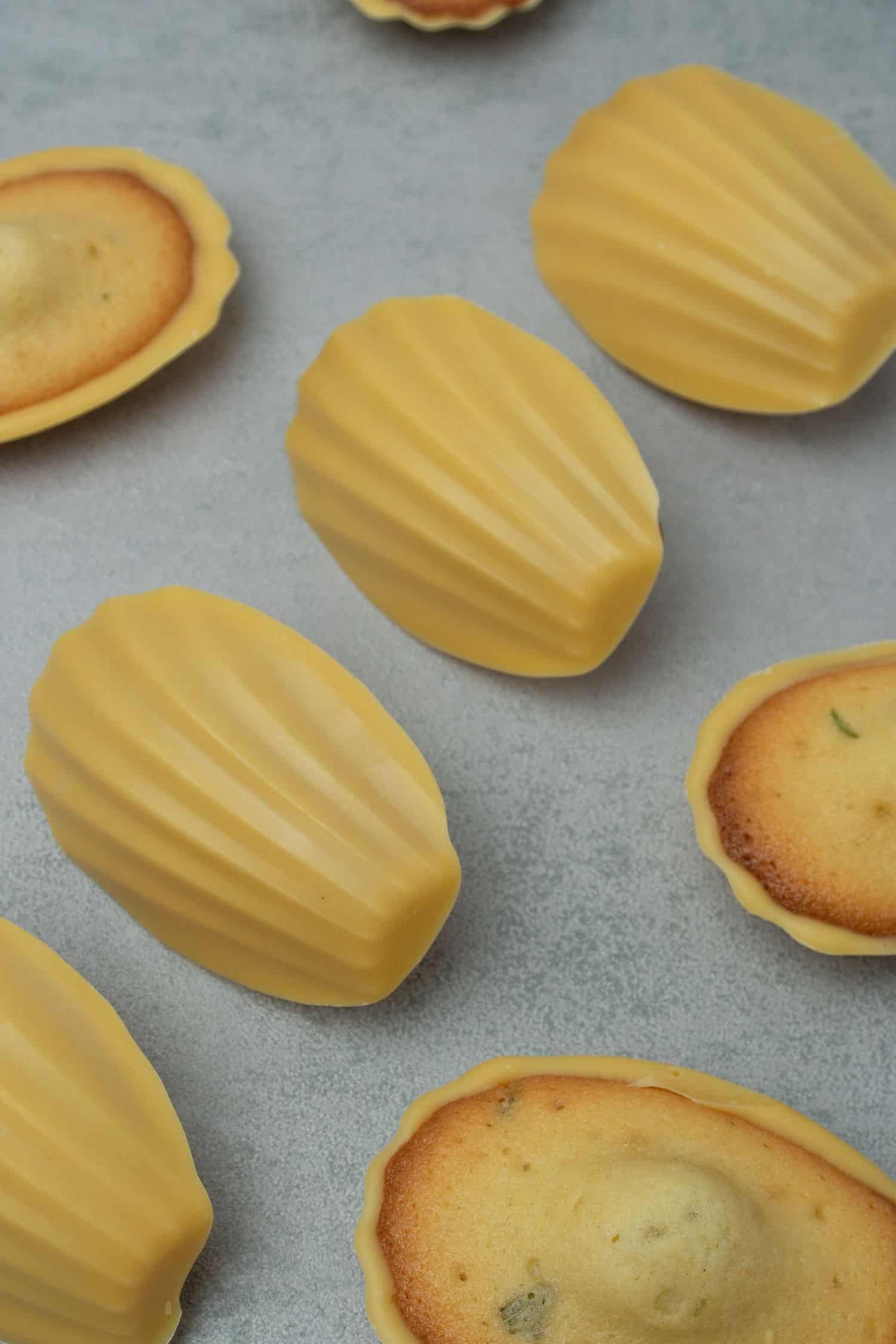 Madeleines covered with passion fruit  chocolate glaze.