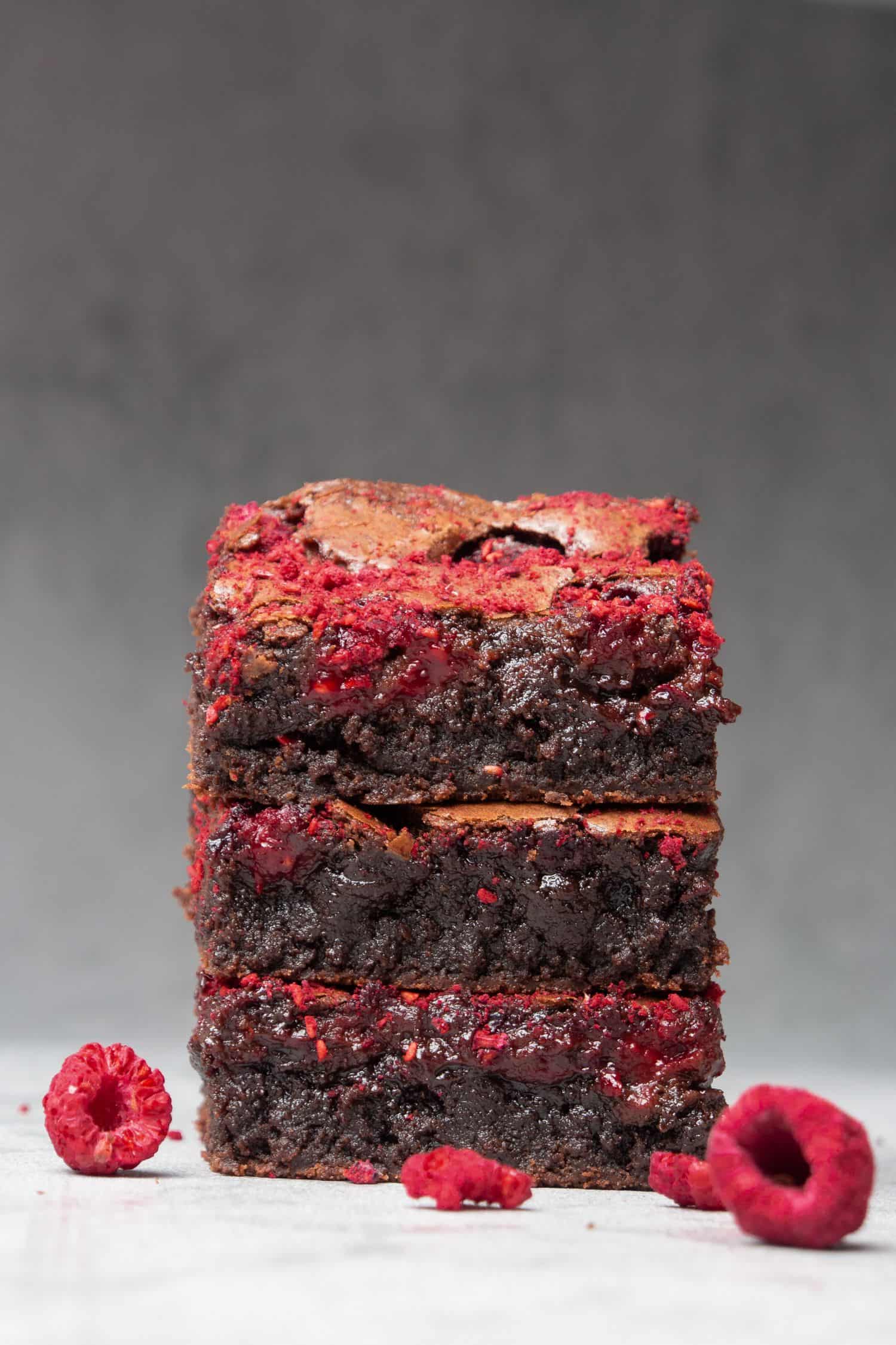 3 Gooey Raspberry brownies on top of each.