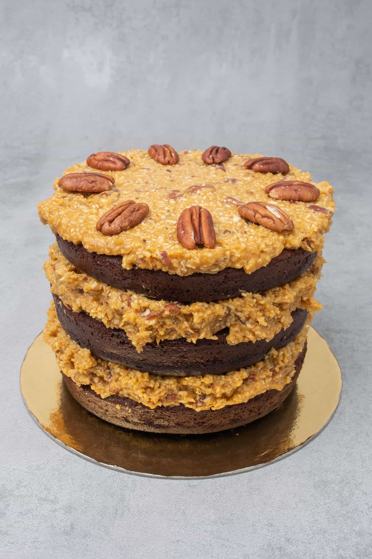 German chocolate cake on a golden paper plate. 