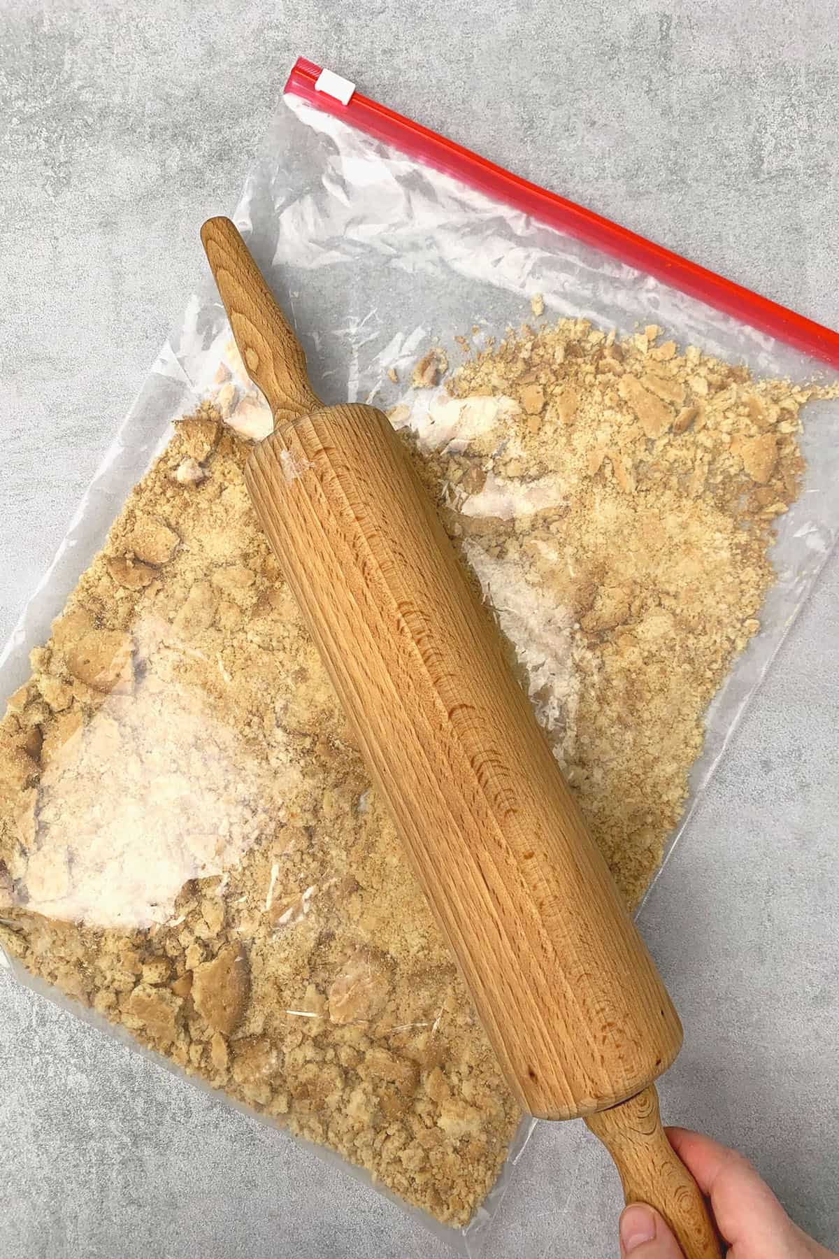 Crashing Graham Cracker in a plastic bag.