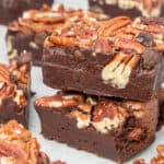 Pecan brownies on top of each other.