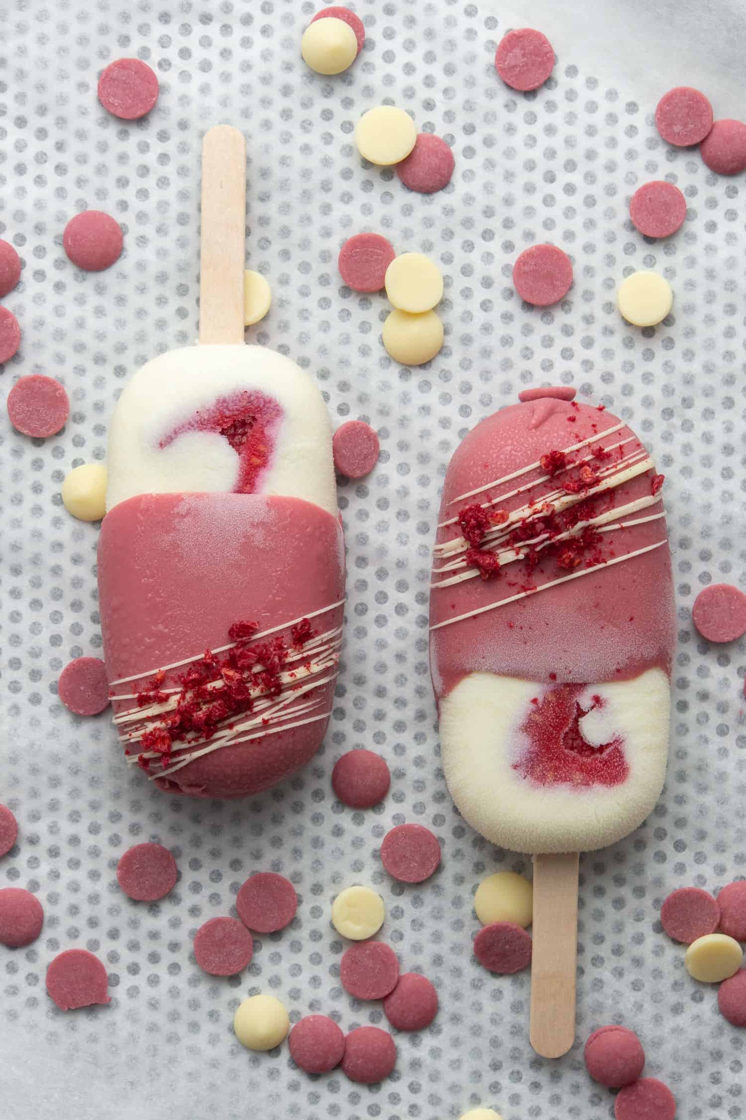 Two pcs of Ruby Raspberry ice cream bar on a baking tray.