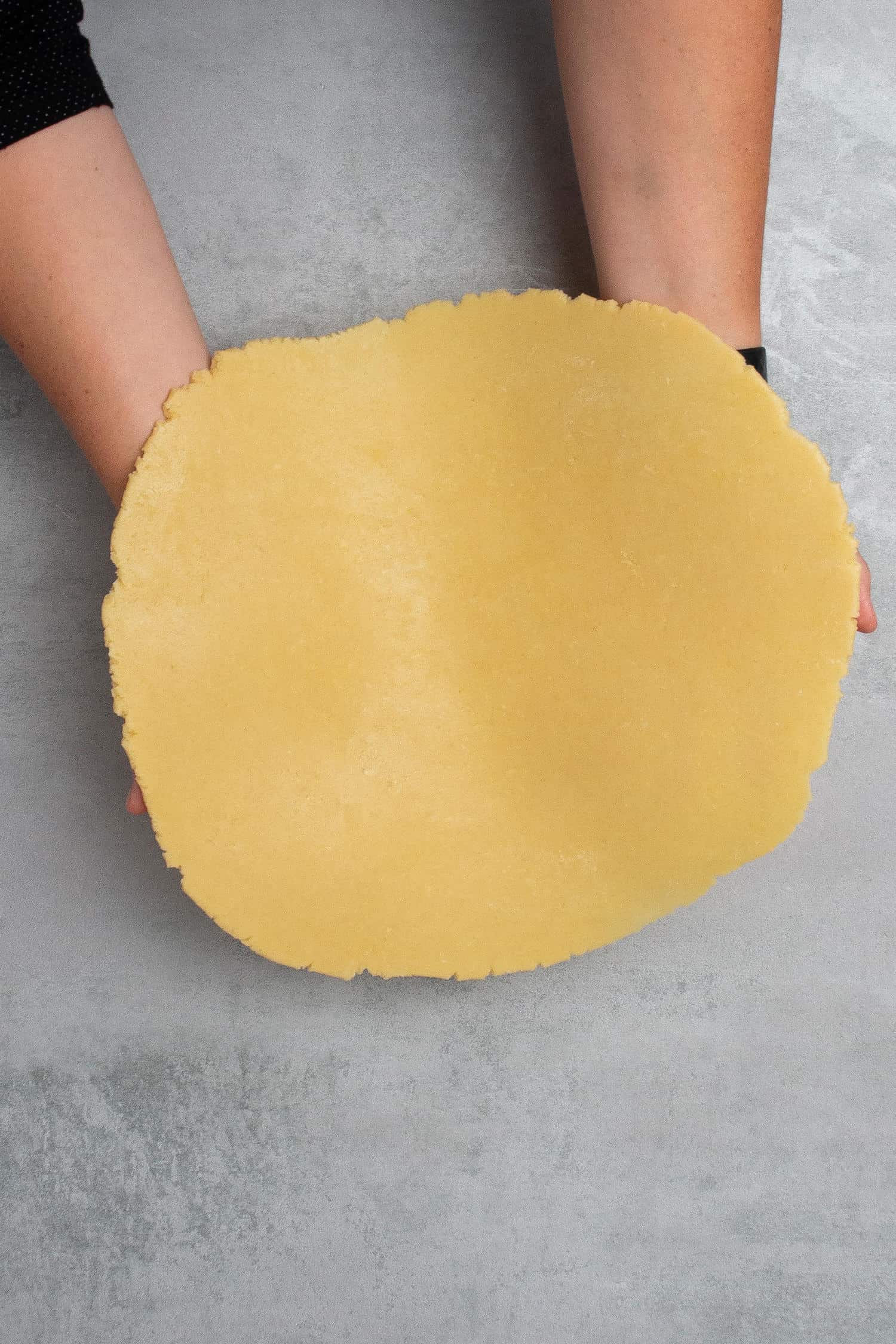 Showing the thin rolled pie dough  