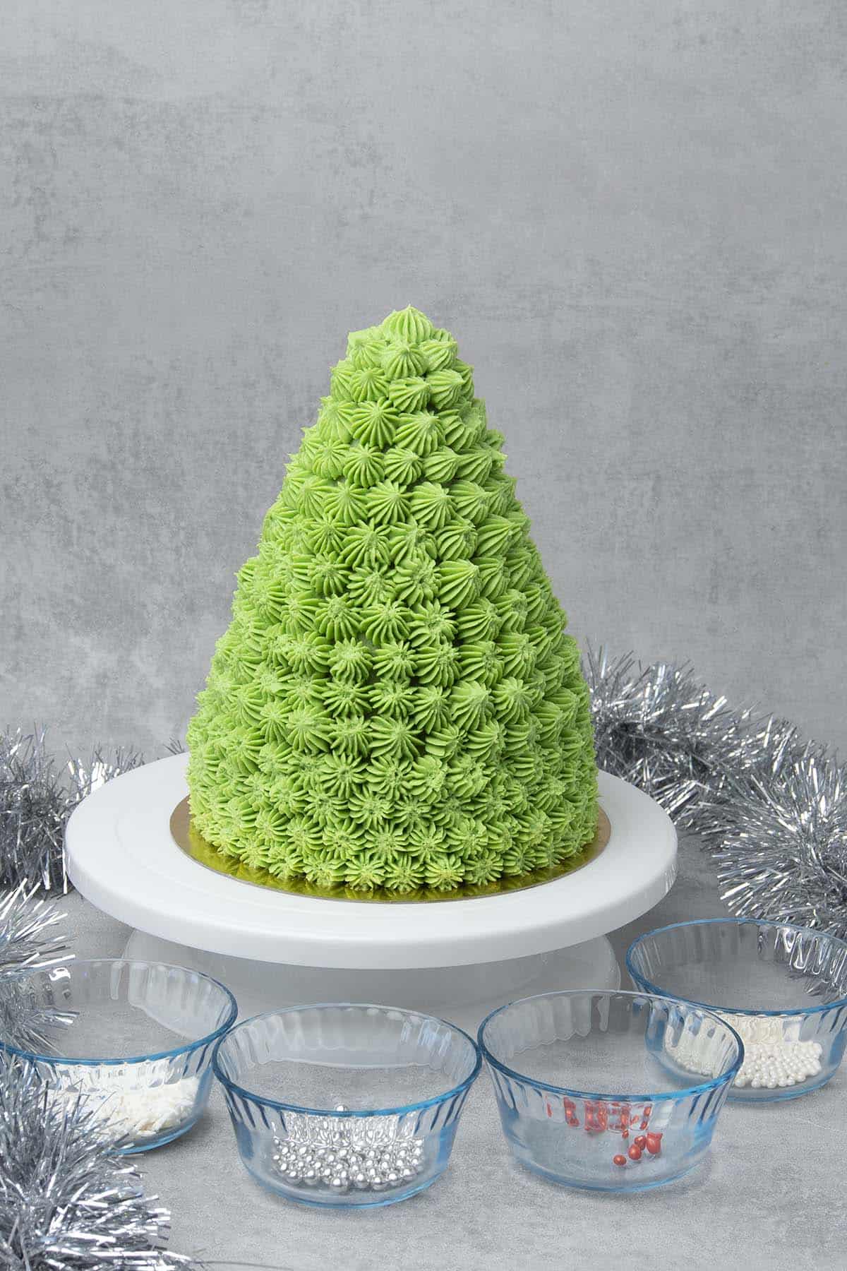 Christmas tree cake on a cake stand without  decoration 