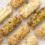 Pistachio, hazelnut and almond Financiers on a white paper
