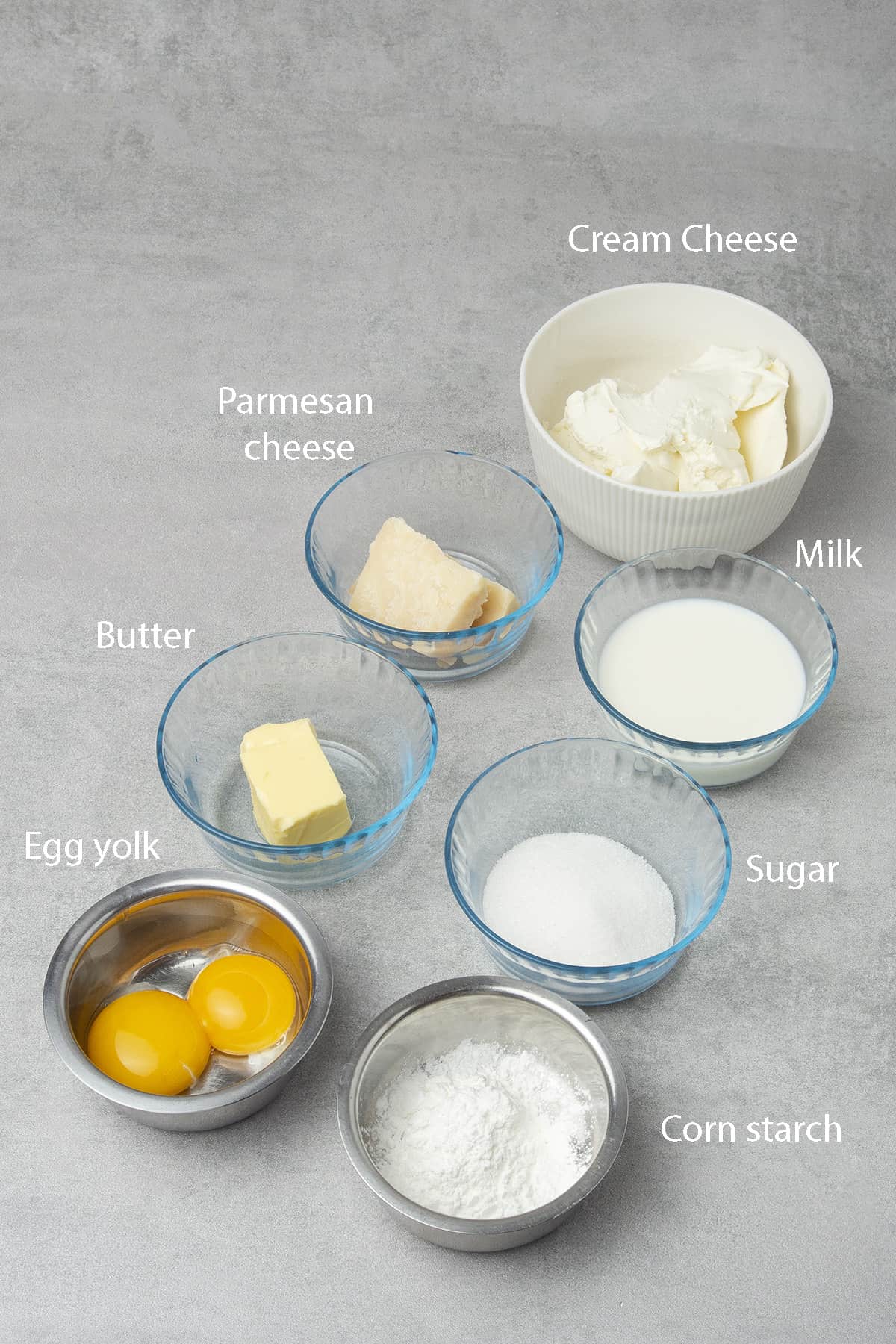 Measured ingredients for the cheese filling on a table top