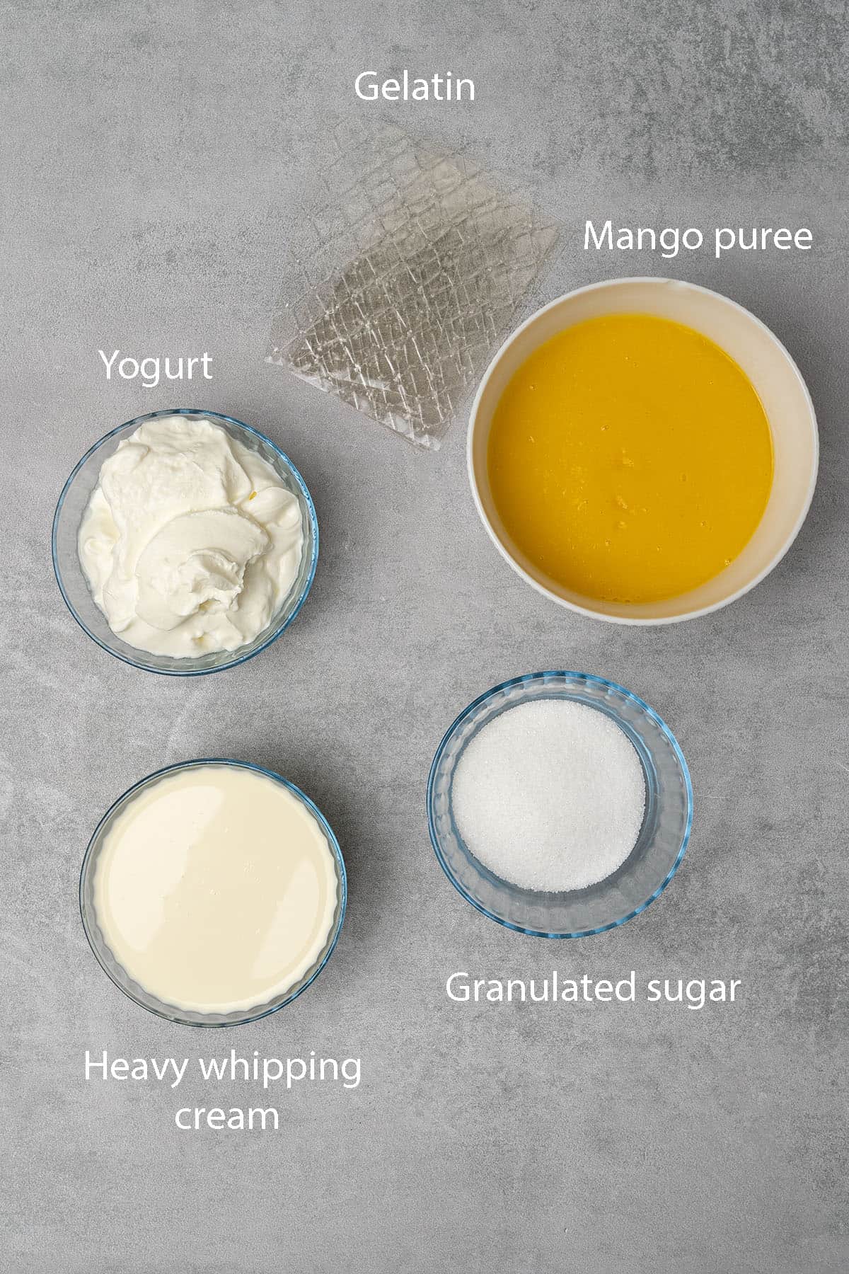 Ingredients measured in bowls for the mango mousse