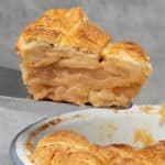Slice of a Baileys apple pie on a cake spoon.