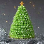 Christmas tree cake on a cake stand.