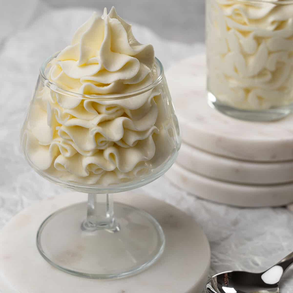 Cream cheese frosting in a glass.