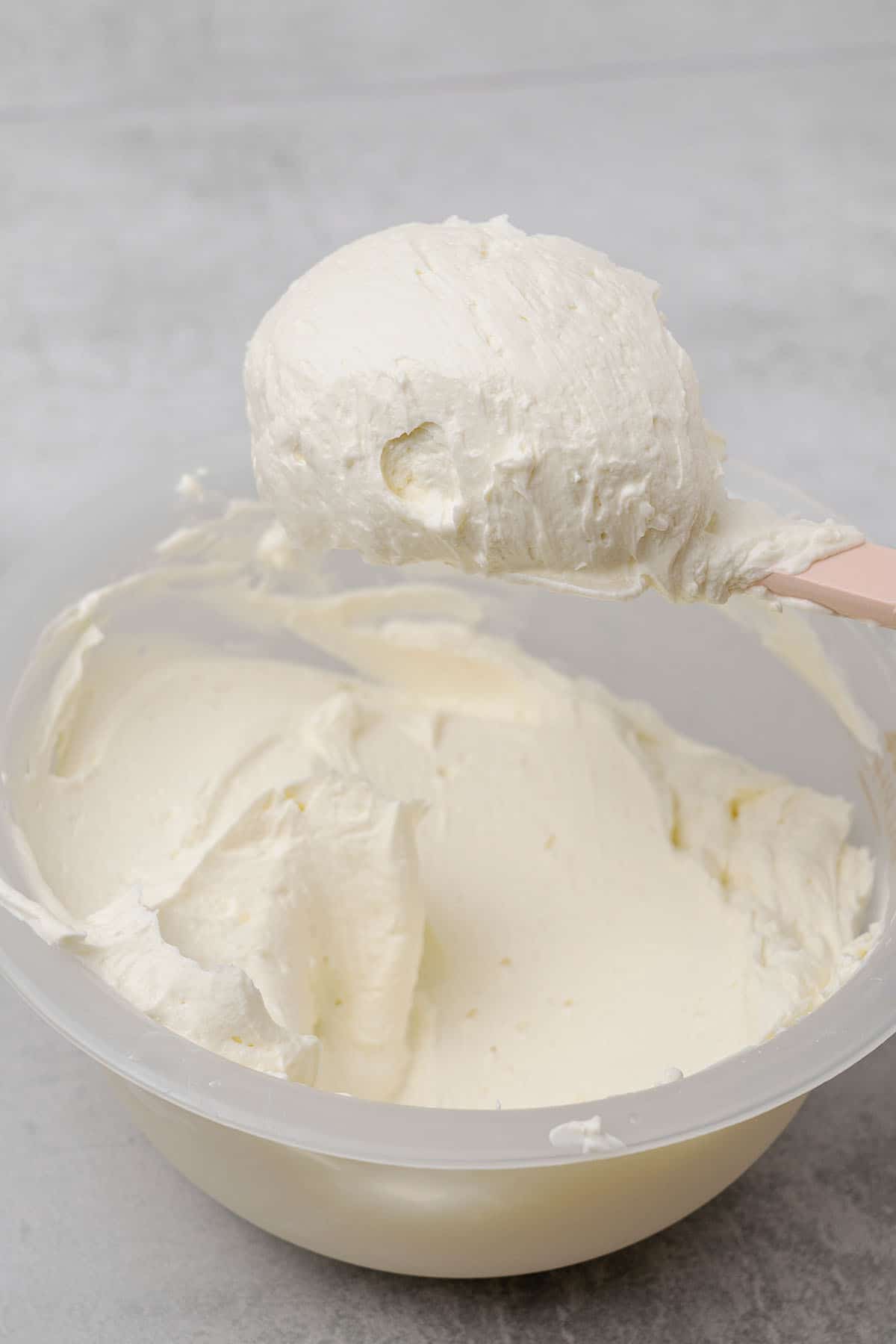 Cream cheese frosting in a bowl.