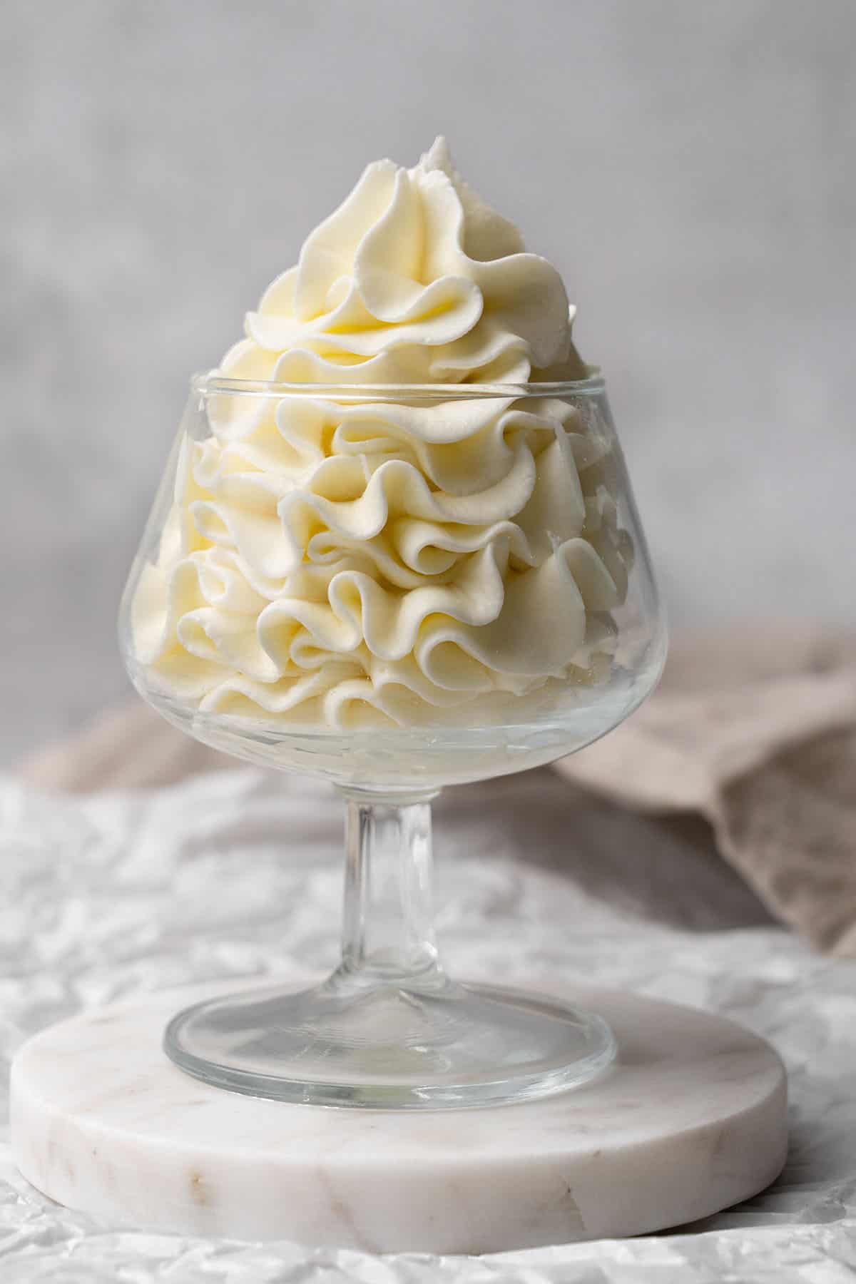Cream cheese frosting in a glass.