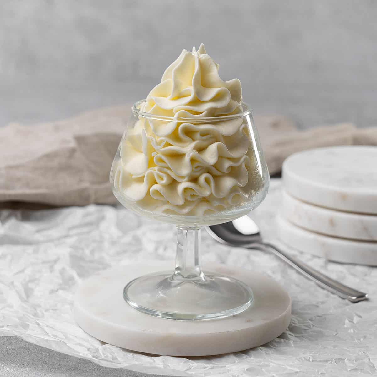 Cream cheese frosting in a glass.