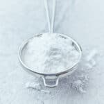 powdered sugar in a colander.