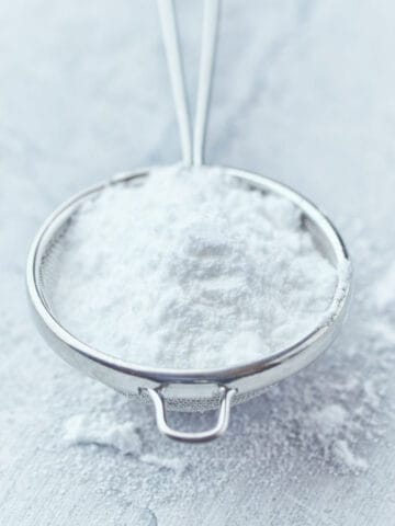 powdered sugar in a colander.
