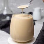 Evaporated milk in a glass.
