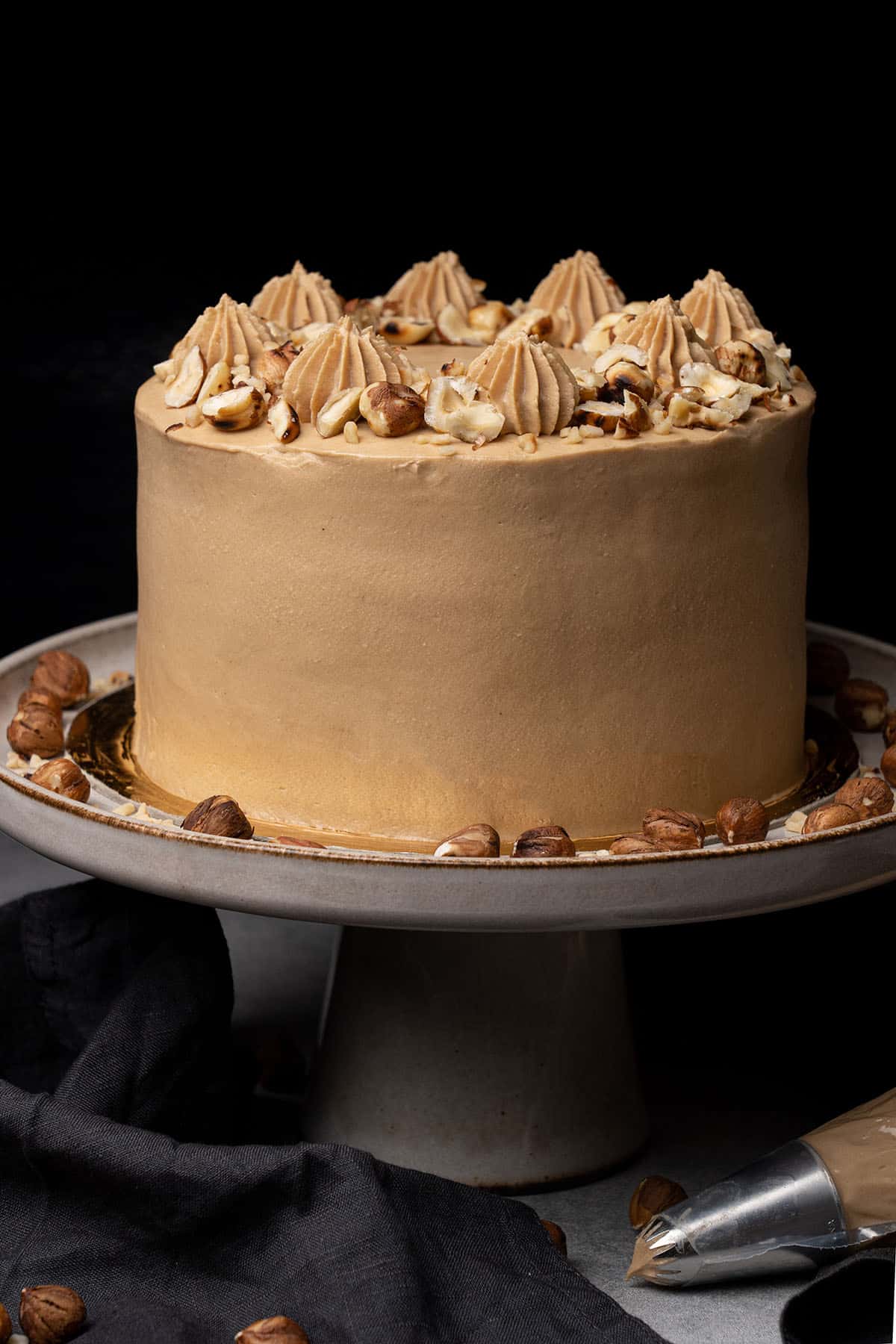 Hazelnut cake on a cake stand.