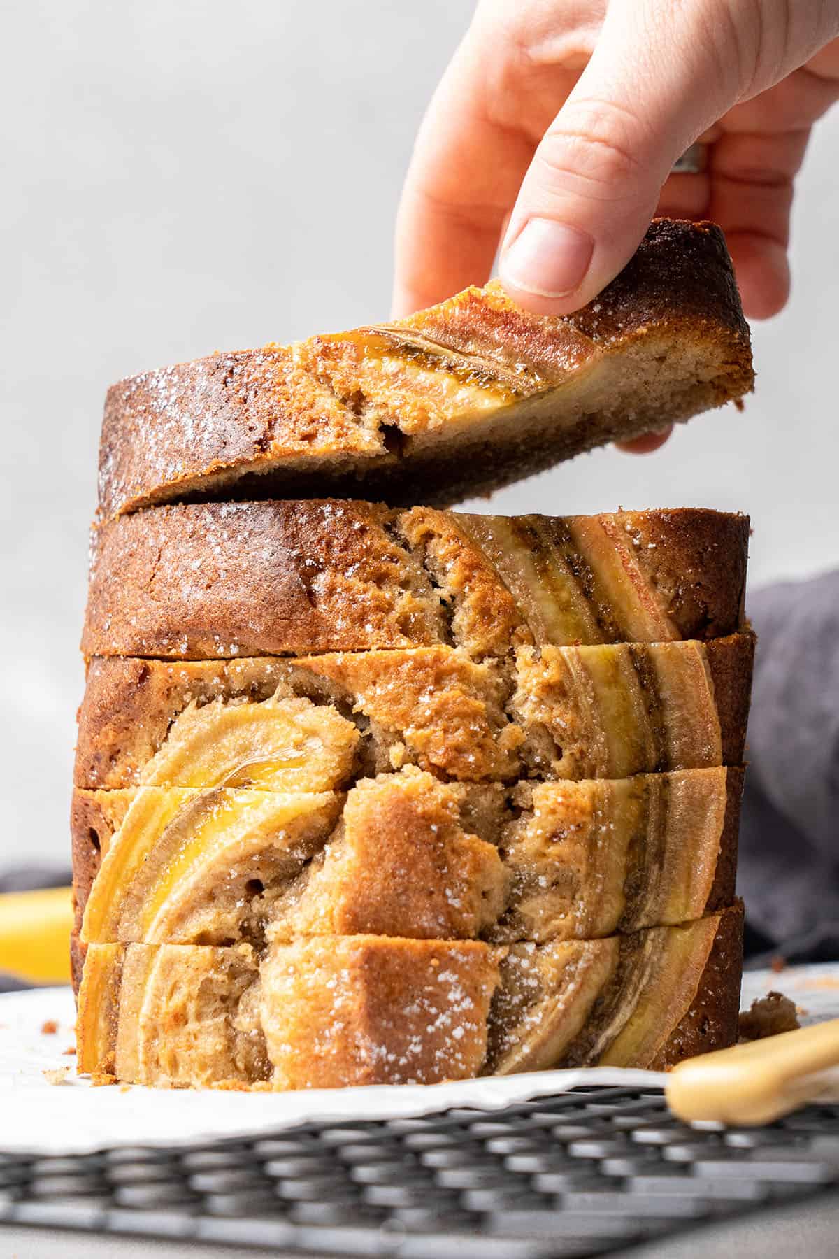 slices of Banana bread on a cooling rack.