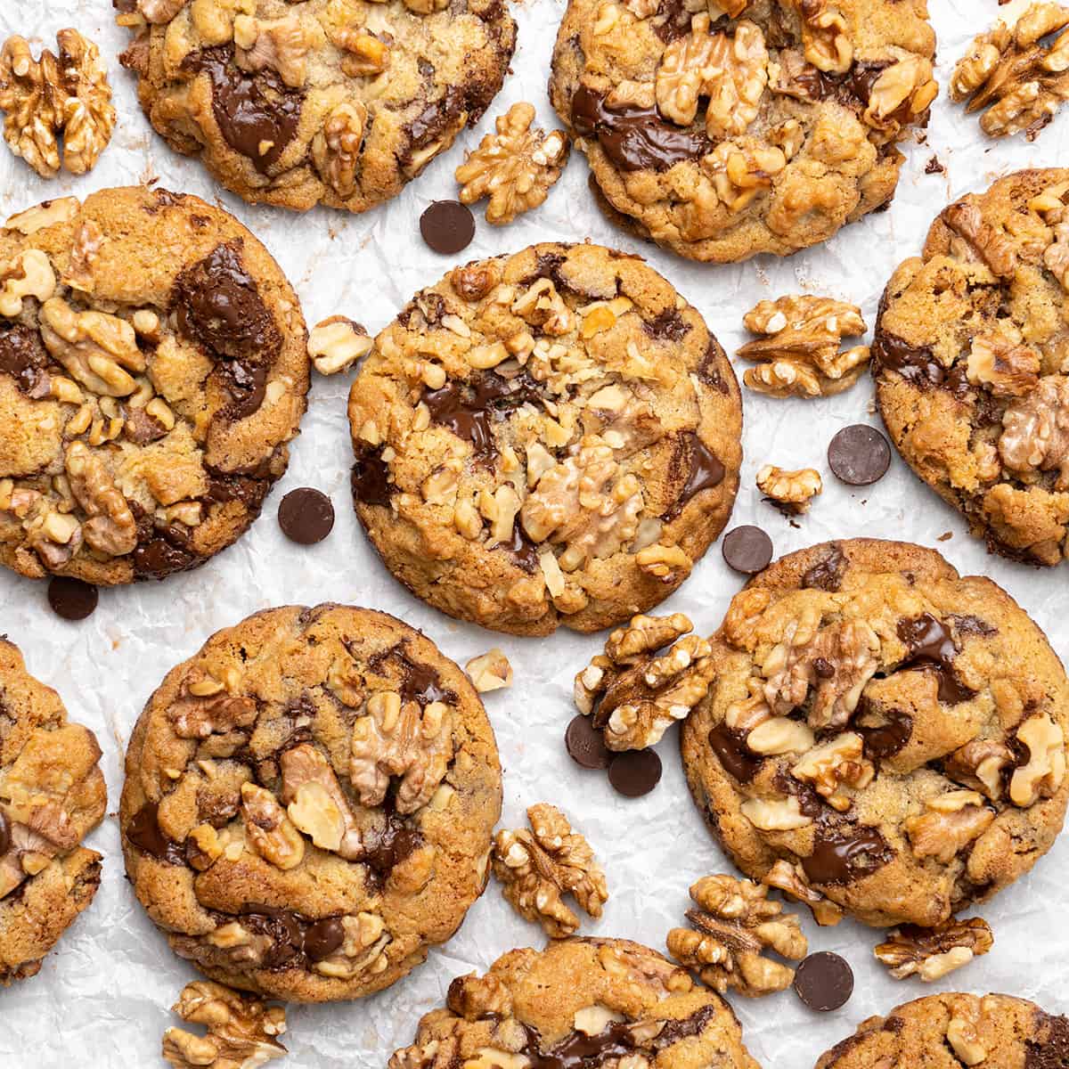 Chocolate chip walnut cookies on a baking sheet.