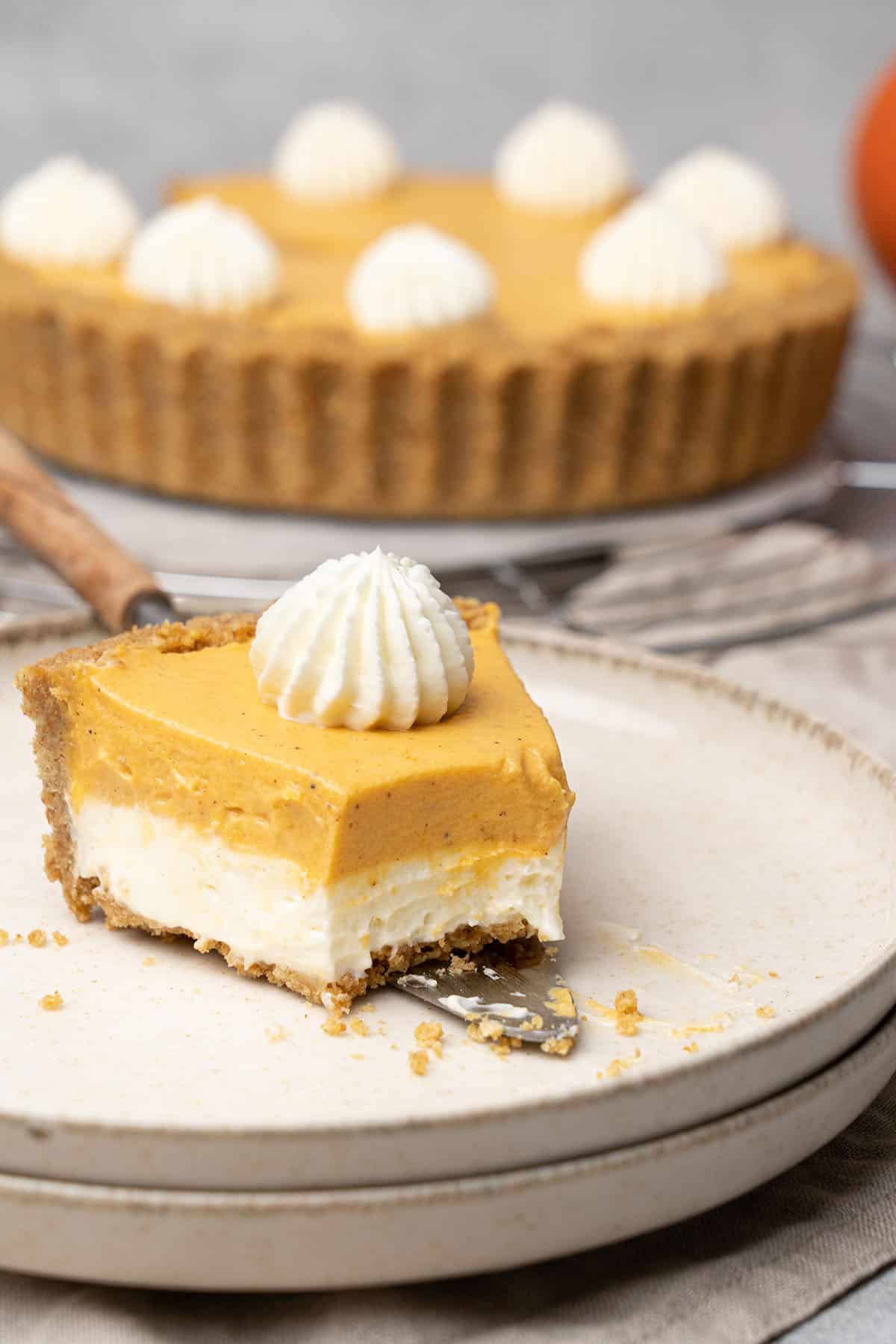 a slice of Double layer Pumpkin pie on a plate.