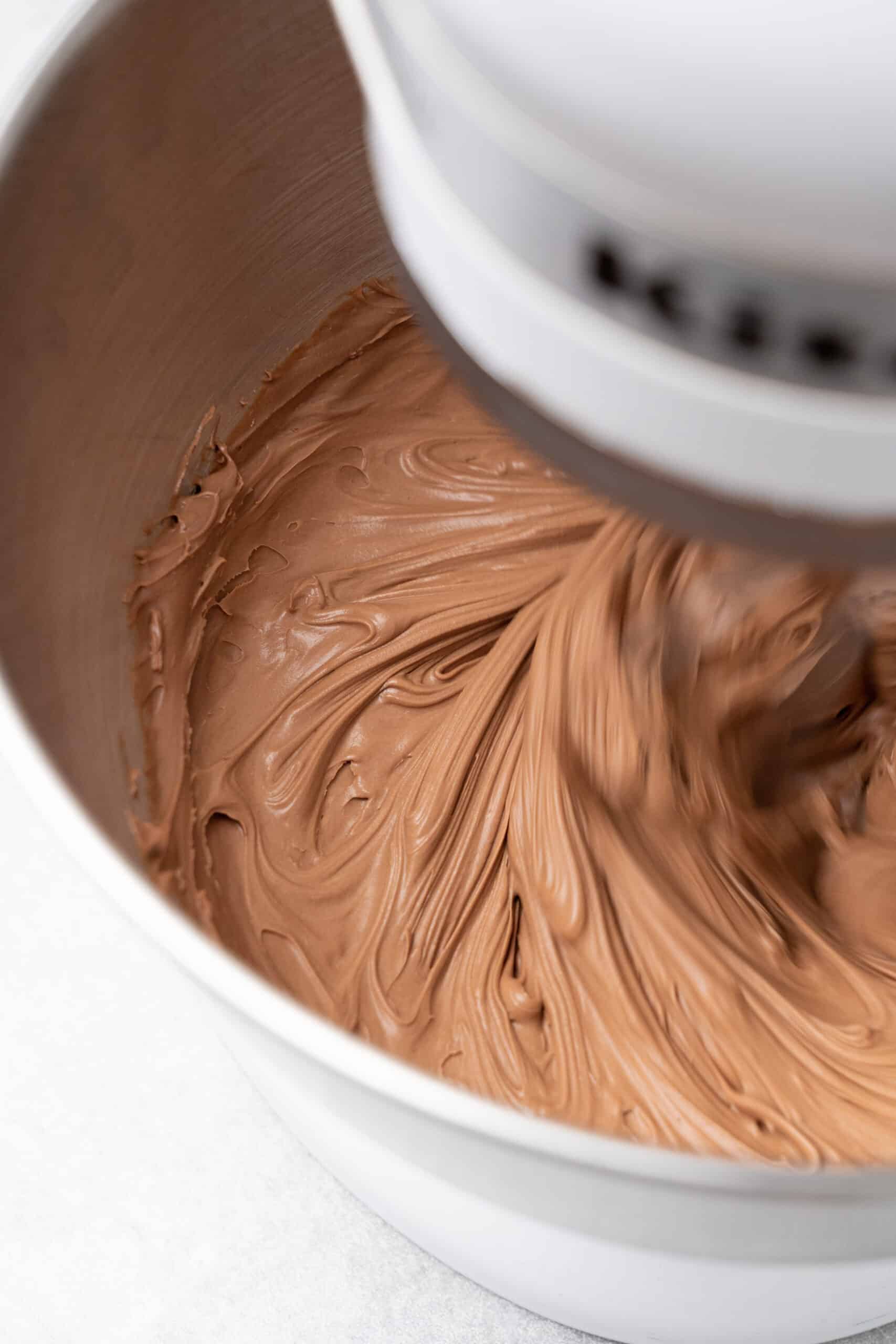 Making nutella frosting in a stand mixer.