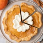 Pumpkin pie with condensed milk on a plate.