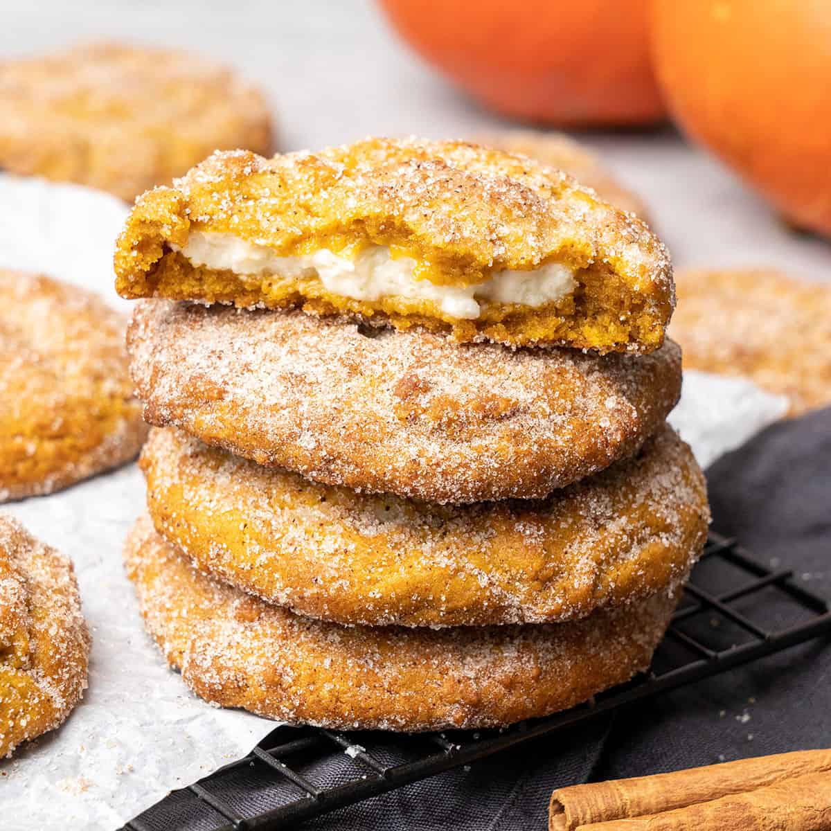 Snickerdoodle Pumpkin Cheesecake Cookies on a cooling rack.