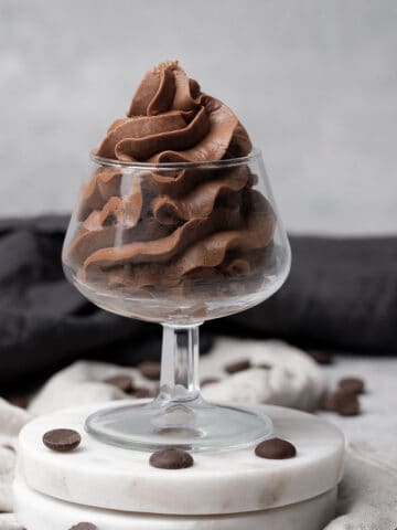 Whipped Chocolate Ganache Frosting in a glass.