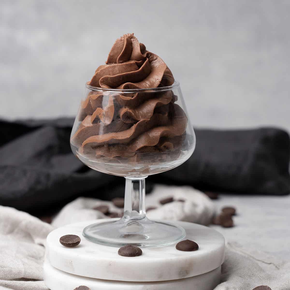 Whipped Chocolate Ganache Frosting in a glass.