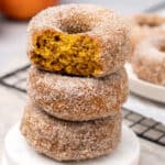 baked pumpkin spice donuts on a plate.