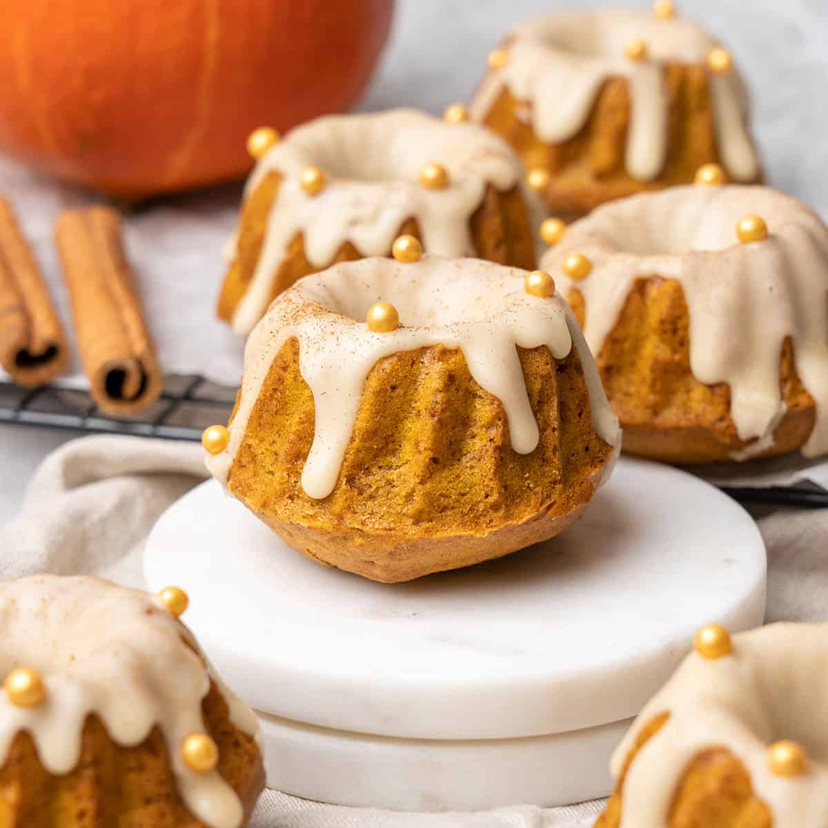 mini pumpkin bundt cakes with maple glaze.