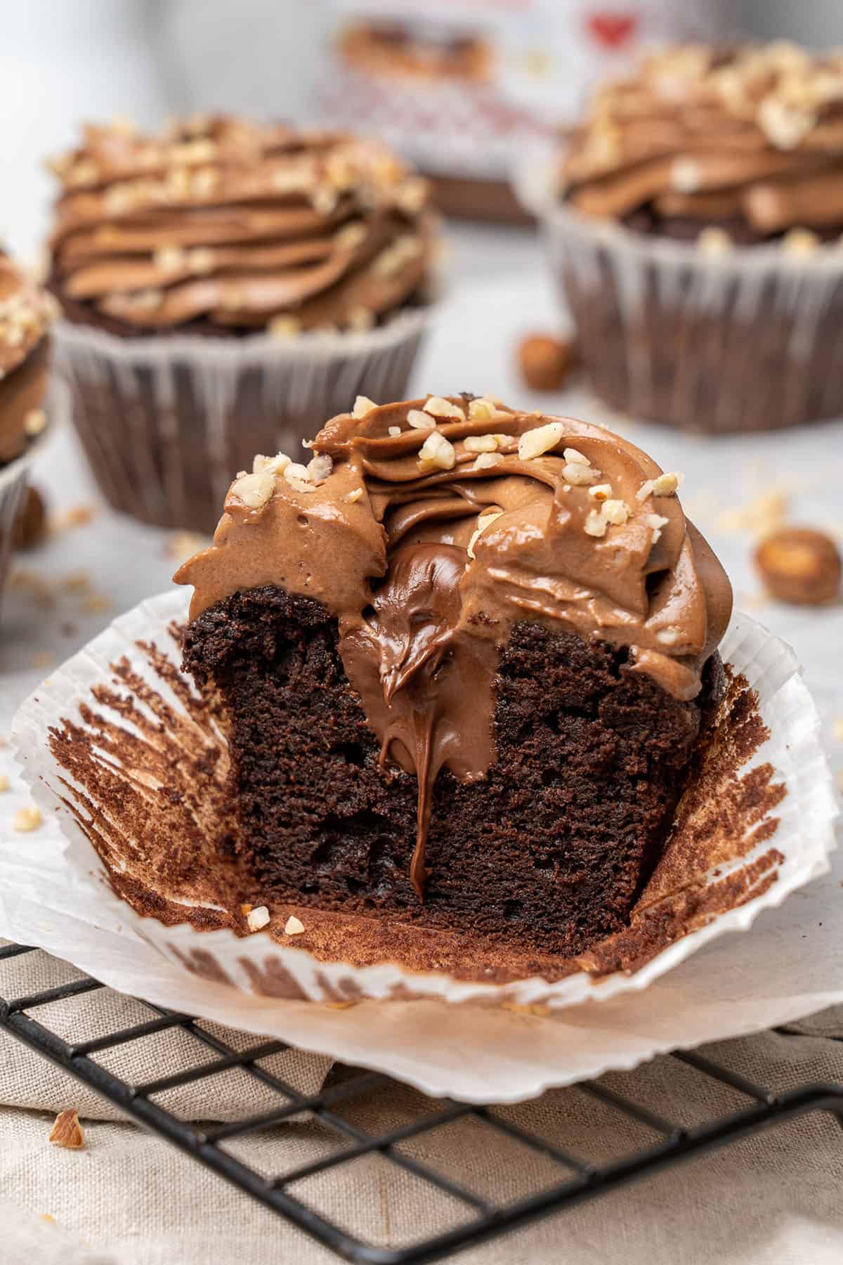 a half Nutella cupcake on a cooling rack.