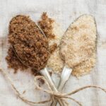 2 different types of sugar in spoons.