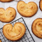 Baked palmiers on a cooling rack.
