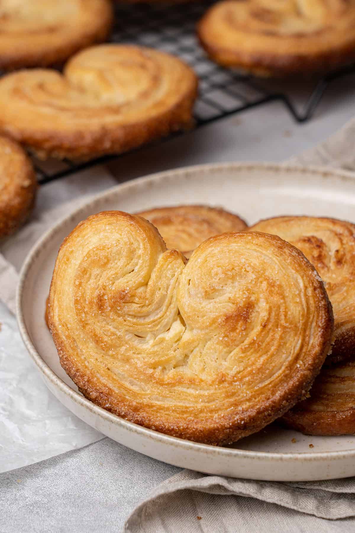 Baked palmiers on a plate.