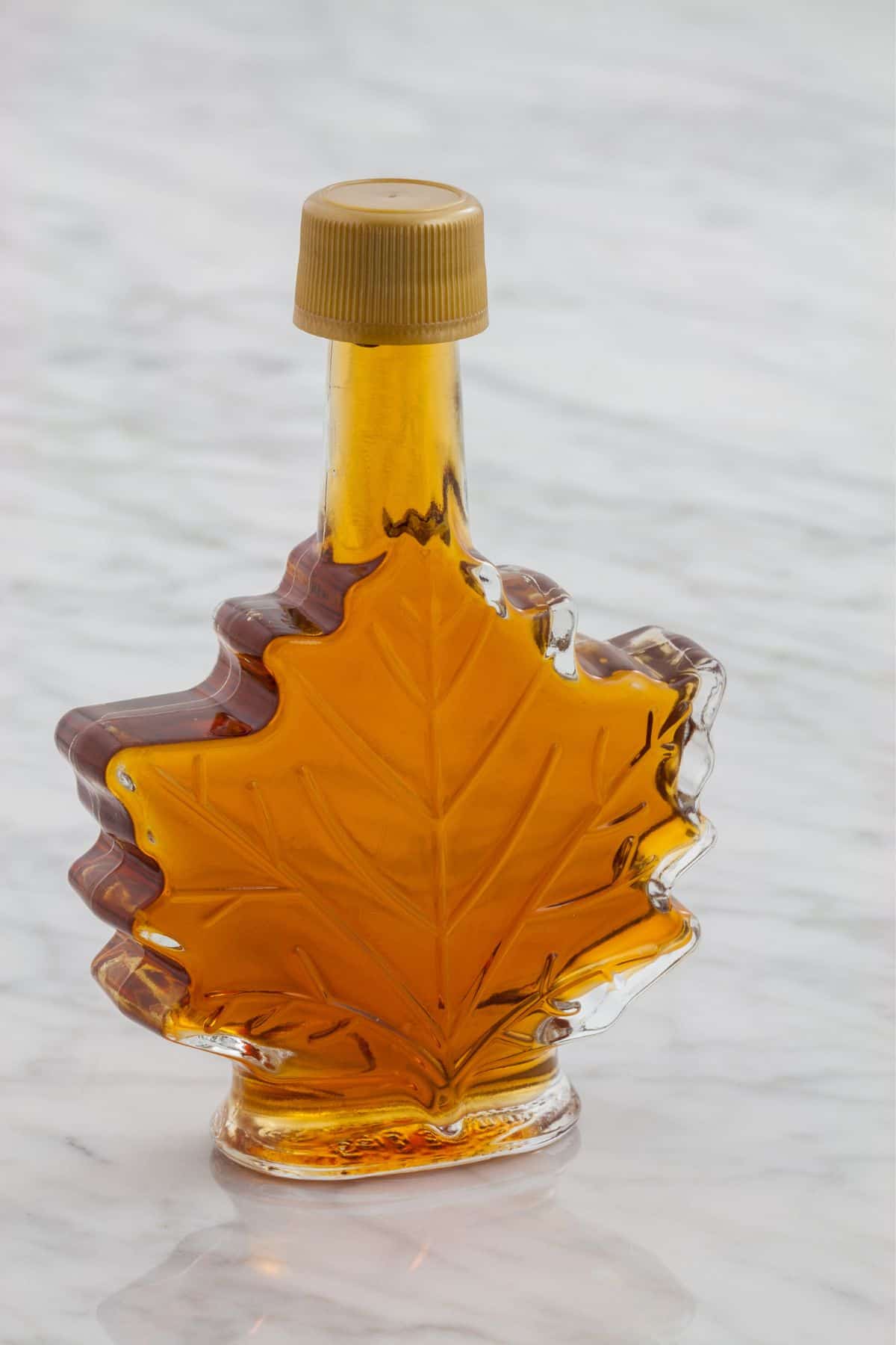 maple syrup in a leaf shape glass.