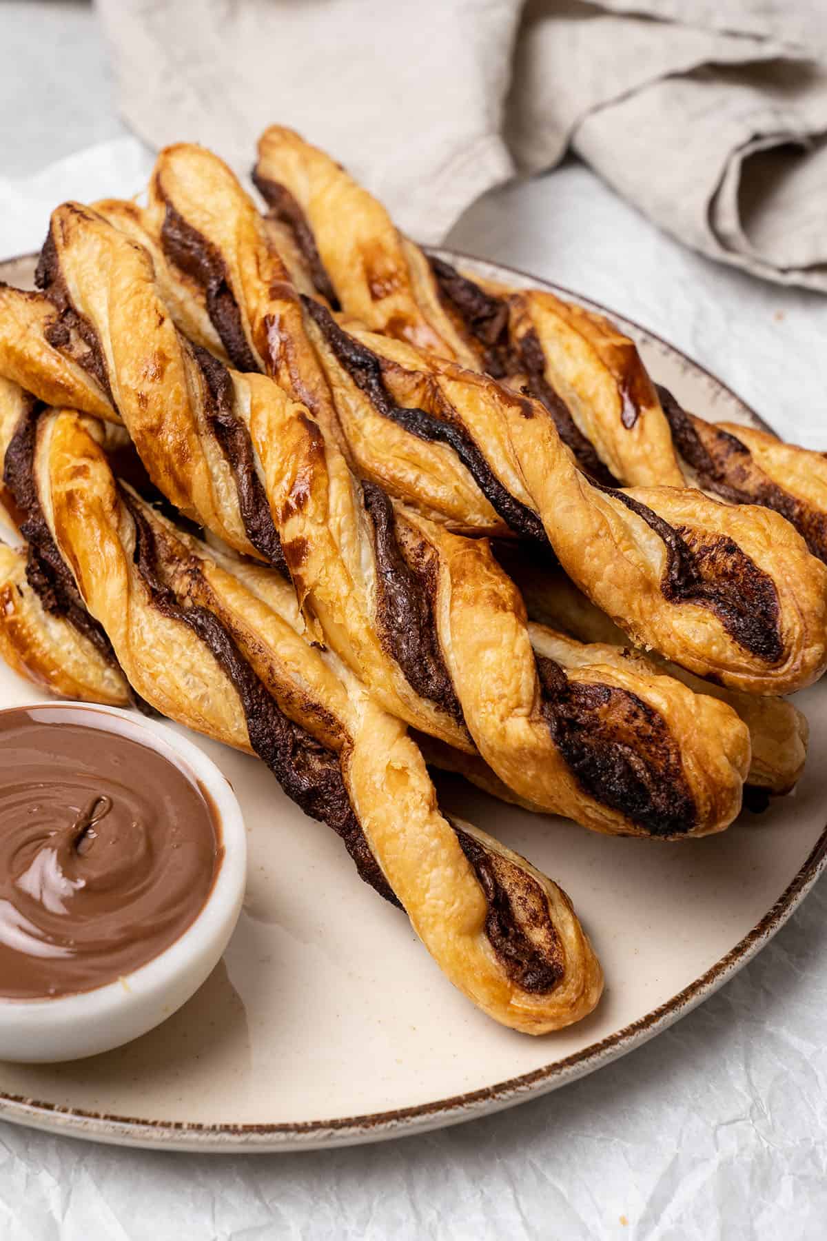 Nutella puff pastry twists on a plate.