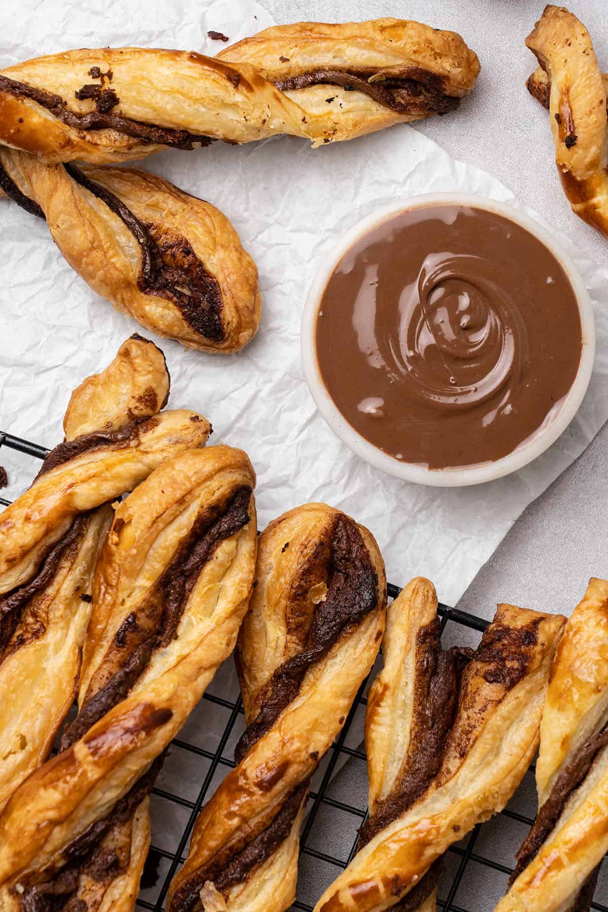 nutella puff pastry twists on a cooling rack.