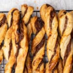 Nutella puff pastry twists on a cooling rack.