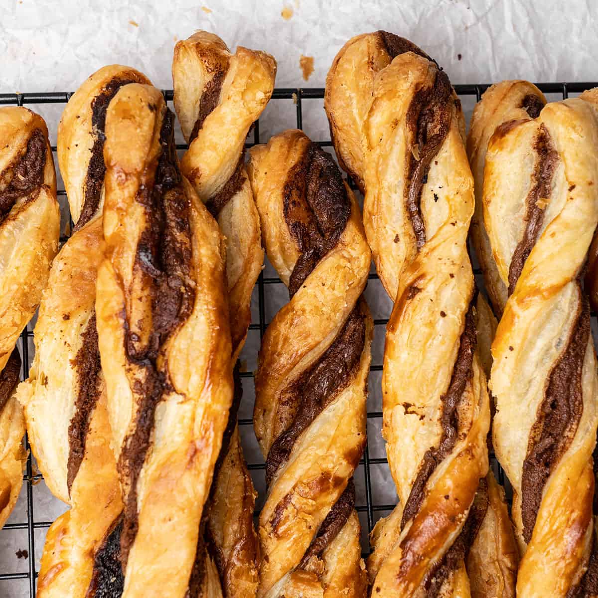 Nutella puff pastry twists on a cooling rack.