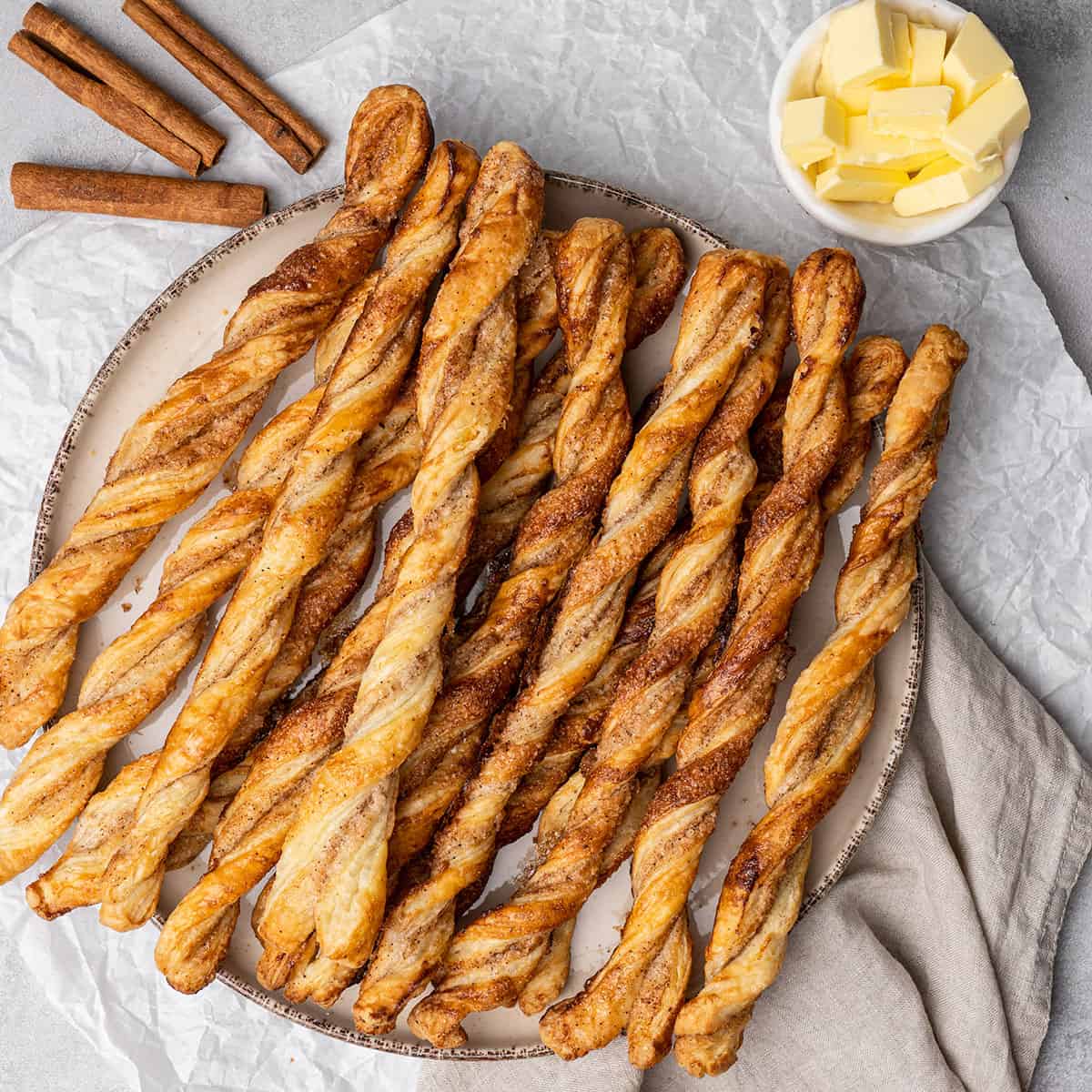 puff pastry cinnamon twists on a plate.