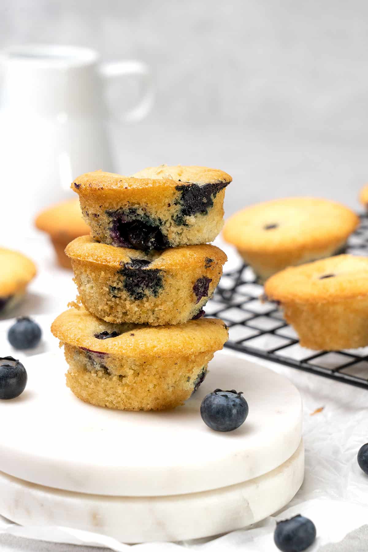 3 Mini blueberry muffins on top of each.