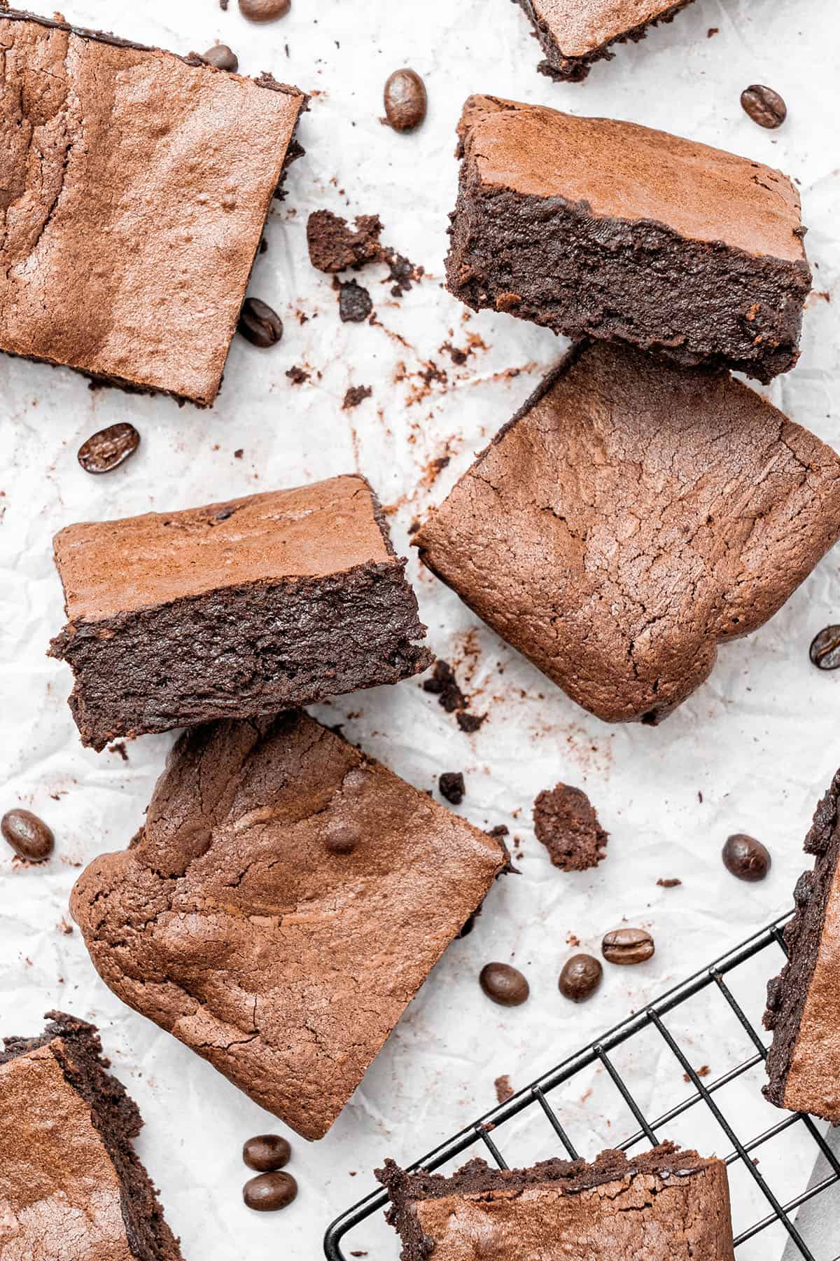 espresso brownies on baking paper and a cooling rack.