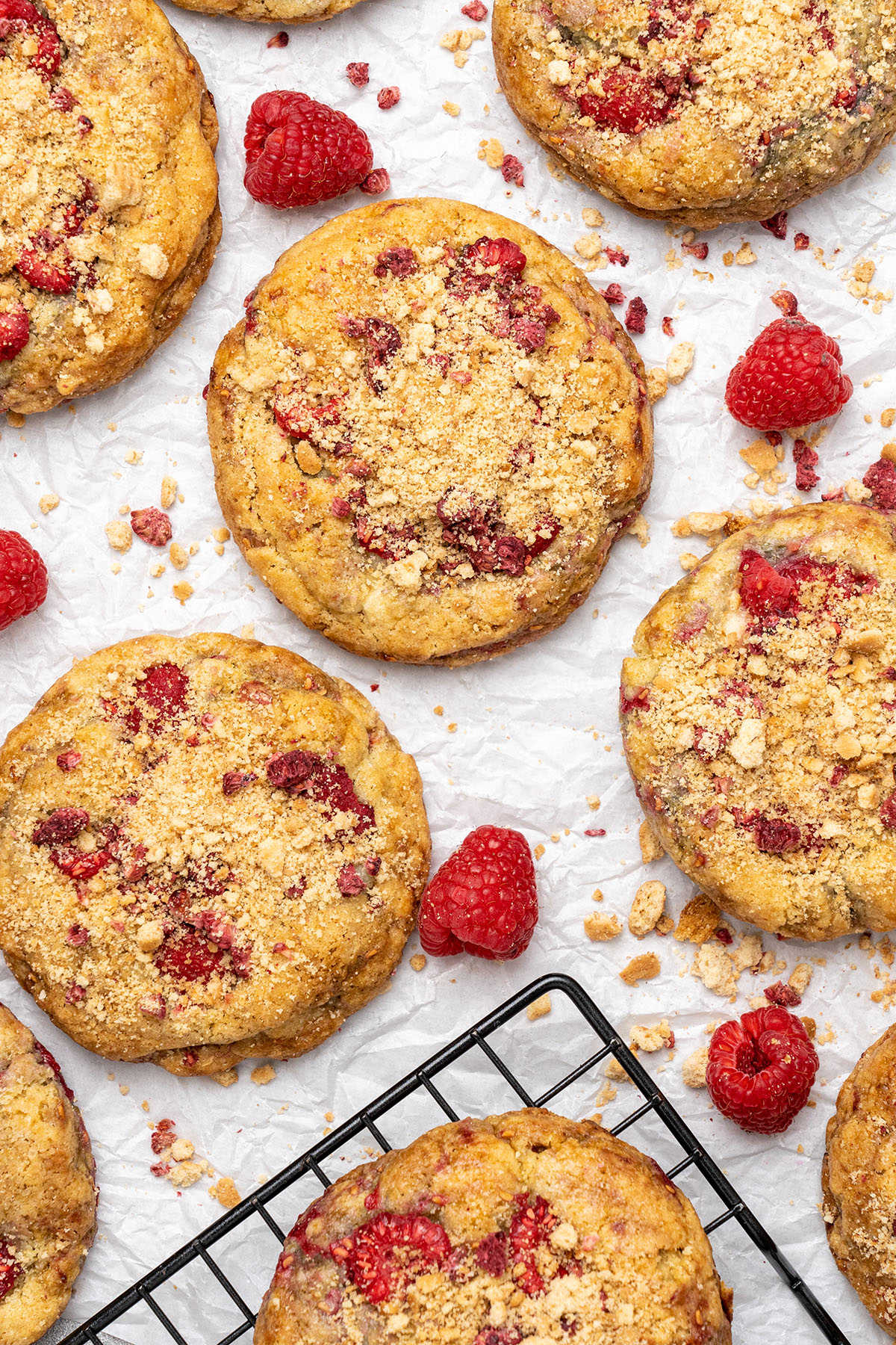 raspberry cheesecake cookies on a cooling rack.