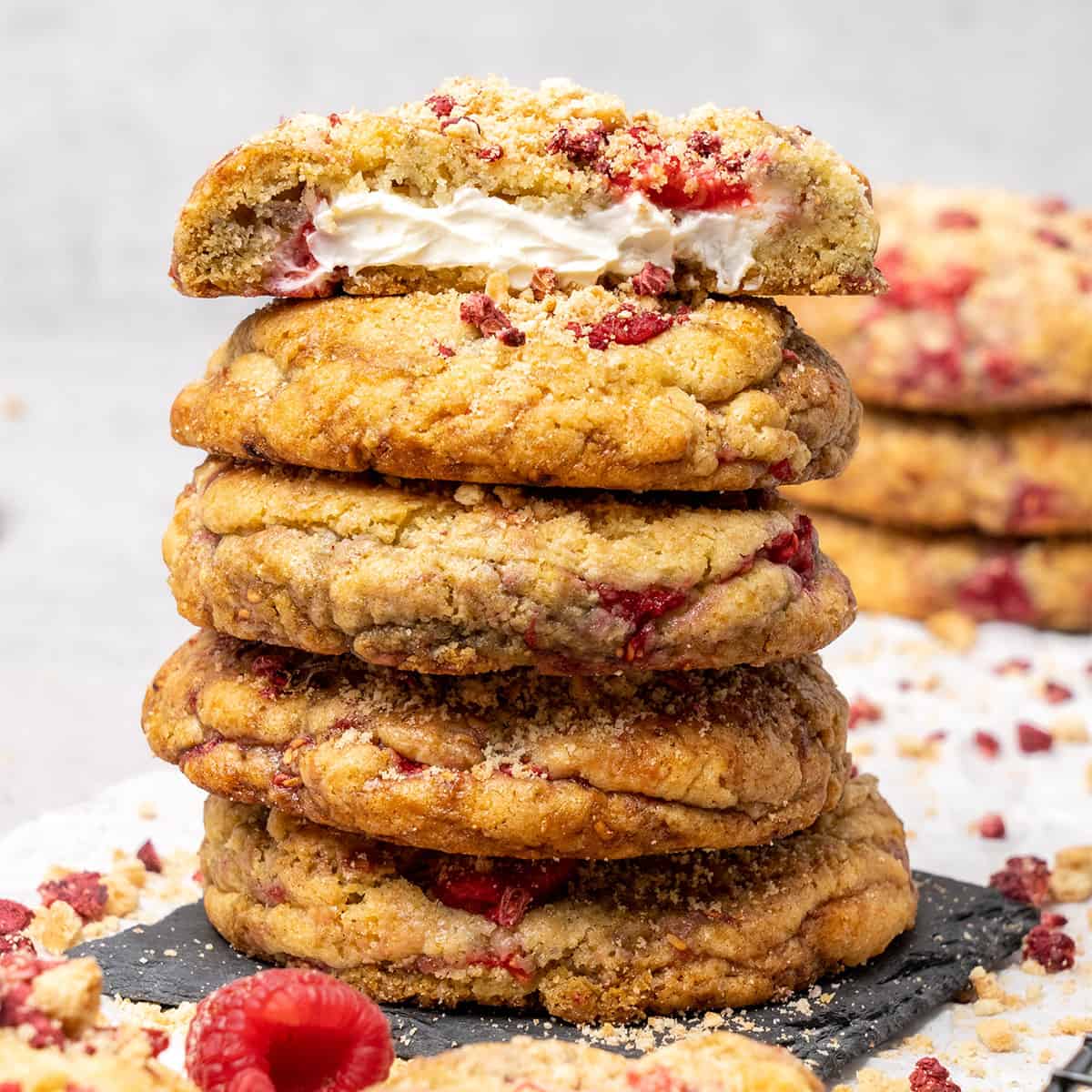 5 raspberry cheesecake cookies on top of each.