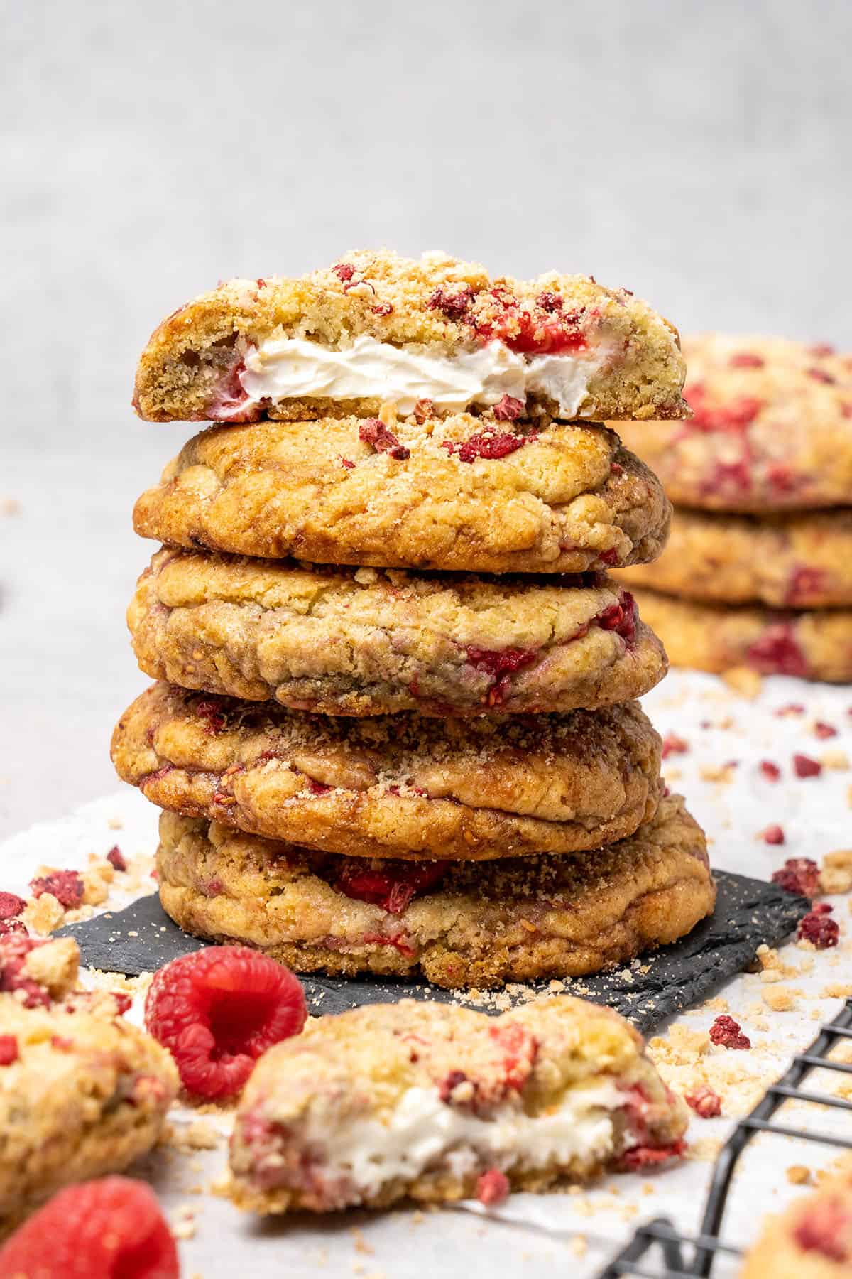 5 raspberry cheesecake cookies on top of each.