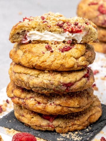5 raspberry cheesecake cookies on top of each.