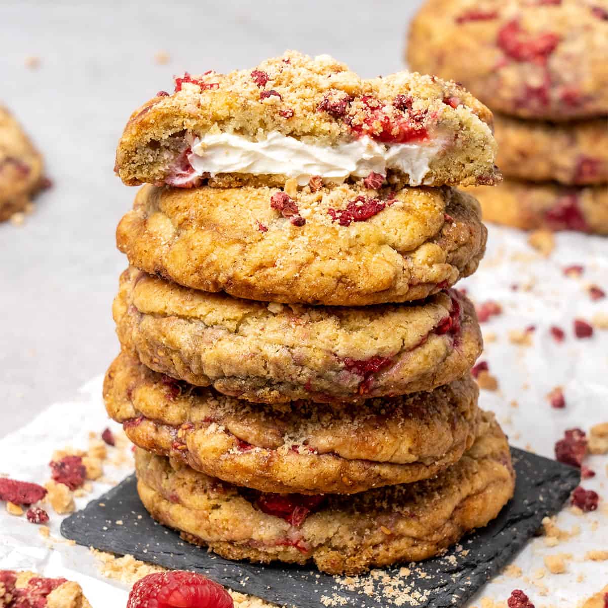 5 raspberry cheesecake cookies on top of each.